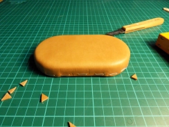 Cutting out little pieces around the corners Cutting out little pieces around the corners